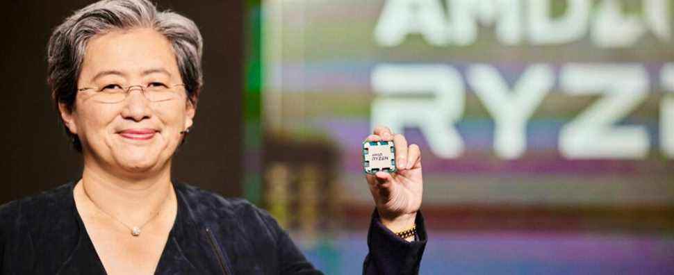 Lisa Su of AMD holding up a Ryzen CPU.