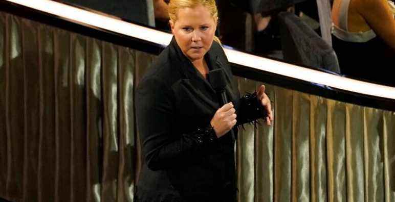 Host Amy Schumer speaks in the audience at the Oscars on Sunday, March 27, 2022, at the Dolby Theatre in Los Angeles. (AP Photo/Chris Pizzello)