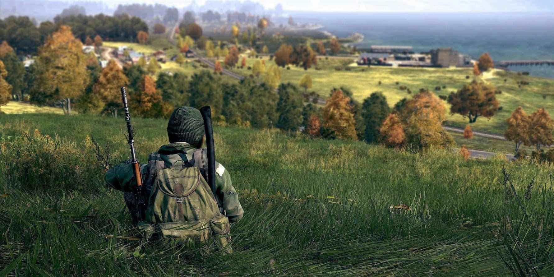 Image from DayZ showing a player sitting down peacefully on a grassy hill.