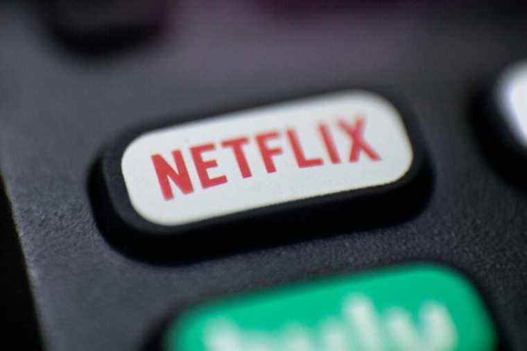 FILE - This Aug. 13, 2020, photo shows a logo for Netflix on a remote control in Portland, Ore. Netflix’s video streaming service suffered the first loss in worldwide subscribers in its history, leading to a massive sell-off of its shares. The company’s customer base fell by 200,000 subscribers during the January-March period, according to a quarterly report released Tuesday, April 19, 2022; its stock dropped by 23% in after-market trading. (AP Photo/Jenny Kane, file)