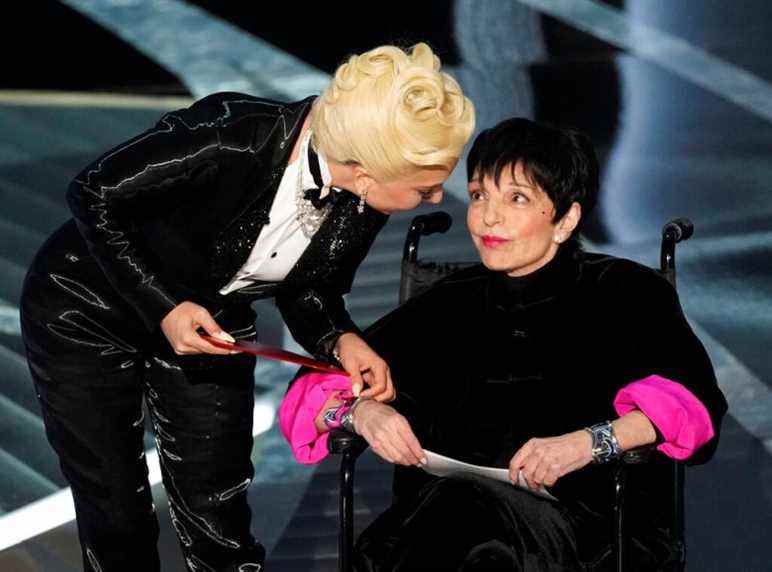 Lady Gaga, left, and Liza Minnelli present the award for best picture at the Oscars on Sunday, March 27, 2022, at the Dolby Theatre in Los Angeles. (AP Photo/Chris Pizzello)