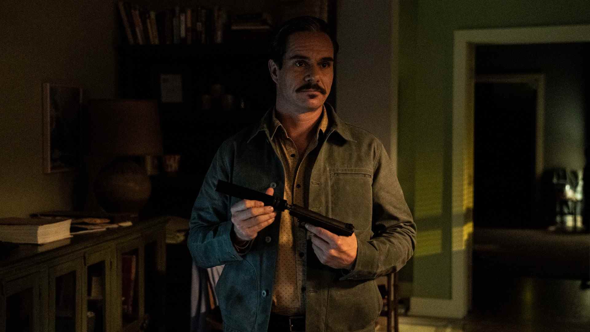 Lalo Salamanca (Tony Dalton) applies a silencer to his pistol in Better Call Saul season 6 episode 7