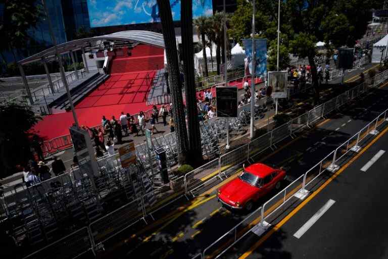 Vintage car drives along the croisette during the 75th international film festival, Cannes, southern France, Saturday, May 21, 2022. (AP Photo/Daniel Cole)