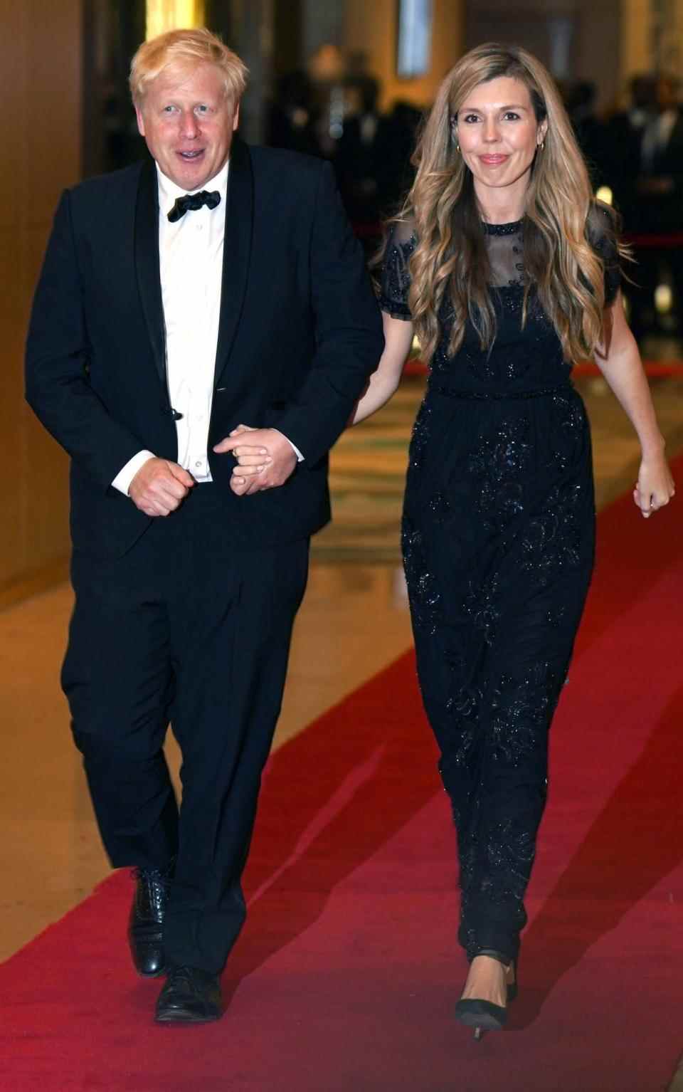 Le Premier ministre Boris Johnson et Carrie Johnson arrivent pour le dîner des chefs de gouvernement du Commonwealth - Jonathan Brady/PA Wire