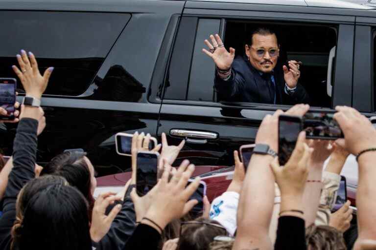 U.S. actor Johnny Depp waves to fans as he leaves the Fairfax Circuit Court on May 26, 2022, in Fairfax, Va. The jury has entered deliberations in the defamation lawsuit filed by U.S. actor Johnny Depp against his former wife, U.S. actress Amber Heard, after she wrote an op-ed in The Washington Post in 2018 that, without naming Depp, accused him of domestic abuse. (Photo by Samuel Corum/Sipa USA)(Sipa via AP Images)