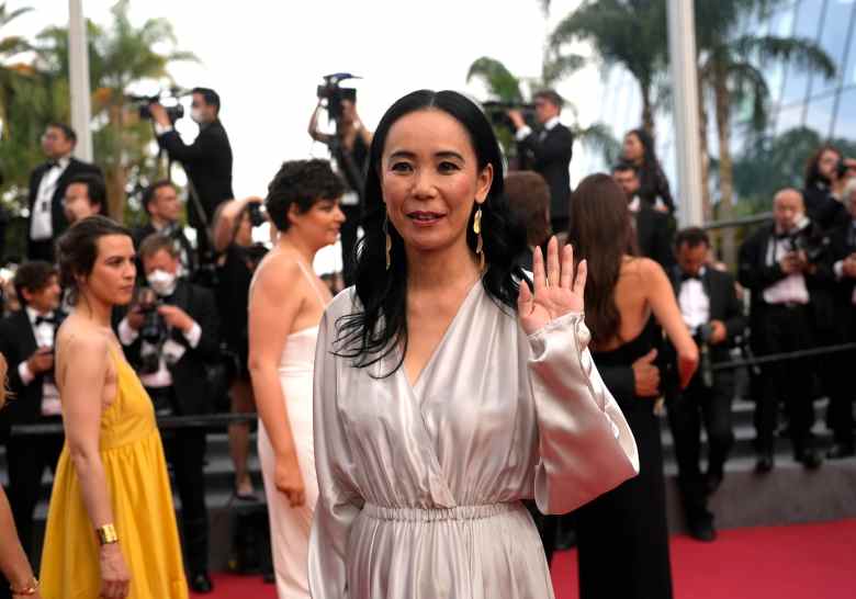 Naomi Kawase poses for photographers upon arrival at the premiere of the film 'Broker at the 75th international film festival, Cannes, southern France, Thursday, May 26, 2022. (AP Photo/Petros Giannakouris)