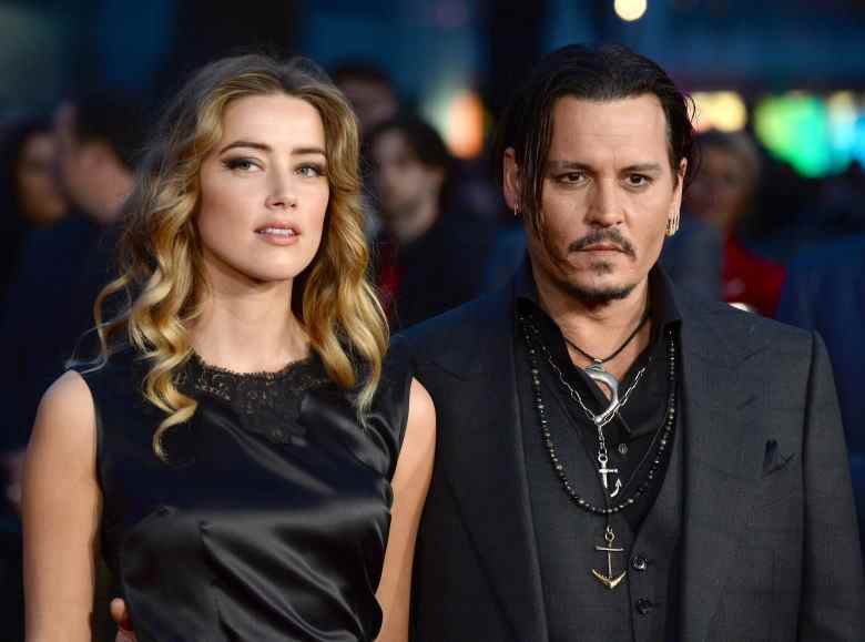 JUNE 1st 2022: A Virginia jury finds both Johnny Depp and Amber Heard liable for defamation and awards Depp $15 million in damages in his libel suit against Heard while awarding $2 million to Ms. Heard in her countersuit. - APRIL 11th 2022: The Johnny Depp / Amber Heard second defamation trial gets underway in Fairfax, Virginia. - File Photo by: zz/DP/AAD/STAR MAX/IPx 2015 10/11/15 Amber Heard and Johnny Depp at the premiere of "Black Mass" held on October 11, 2015 during the 59th BFI London Film Festival in London, England, UK.