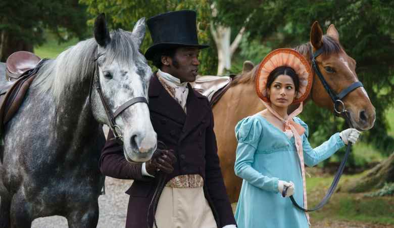 A man in a top hat and woman in a dress and bonnet stand next to a horse; still from "Mr. Malcolm's List."Bl