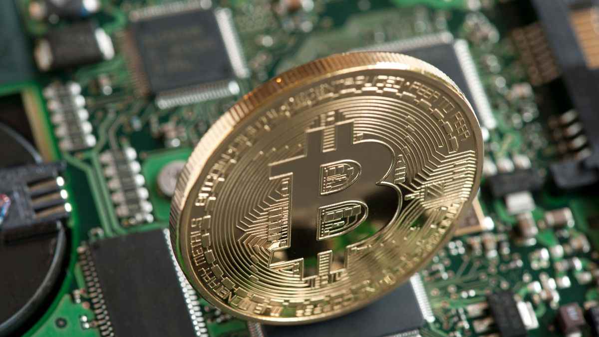 Image of a physical Bitcoin on a PCB.