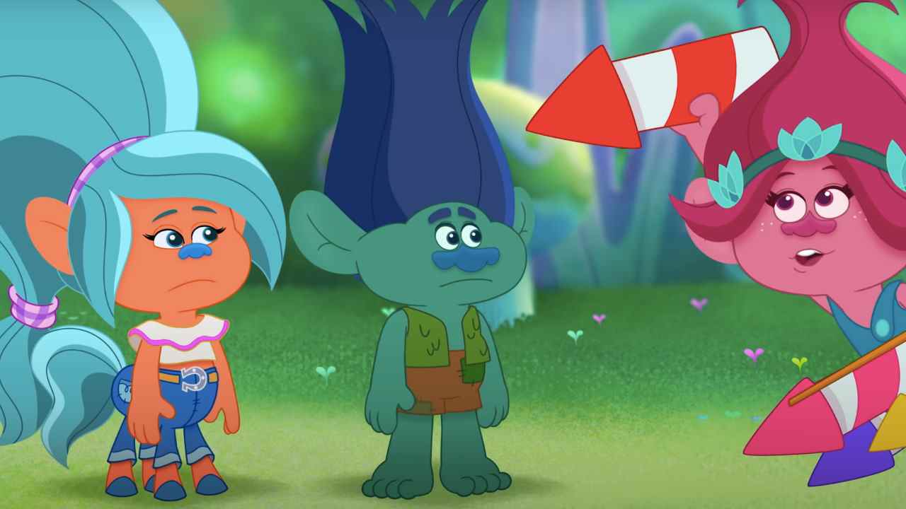 Poppy montre des feux d'artifice à ses camarades trolls dans Trolls TrollsTopia.