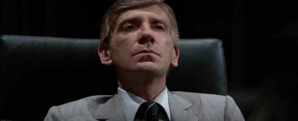 David Warner sits in his office looking annoyed in Tron.