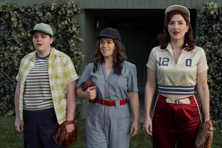 Three women in 1940s-era athletic clothing, holding baseball mitts; still from "A League of Their Own."