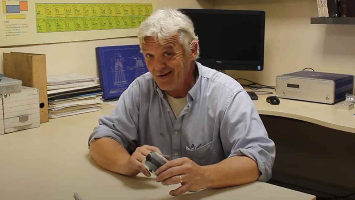 Robert Murray-Smith showing off the paper battery he