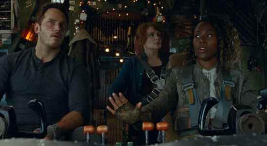 Chris Pratt, Bryce Dallas Howard, and DeWanda Wise look up from the cockpit with concern in Jurassic World Dominion.