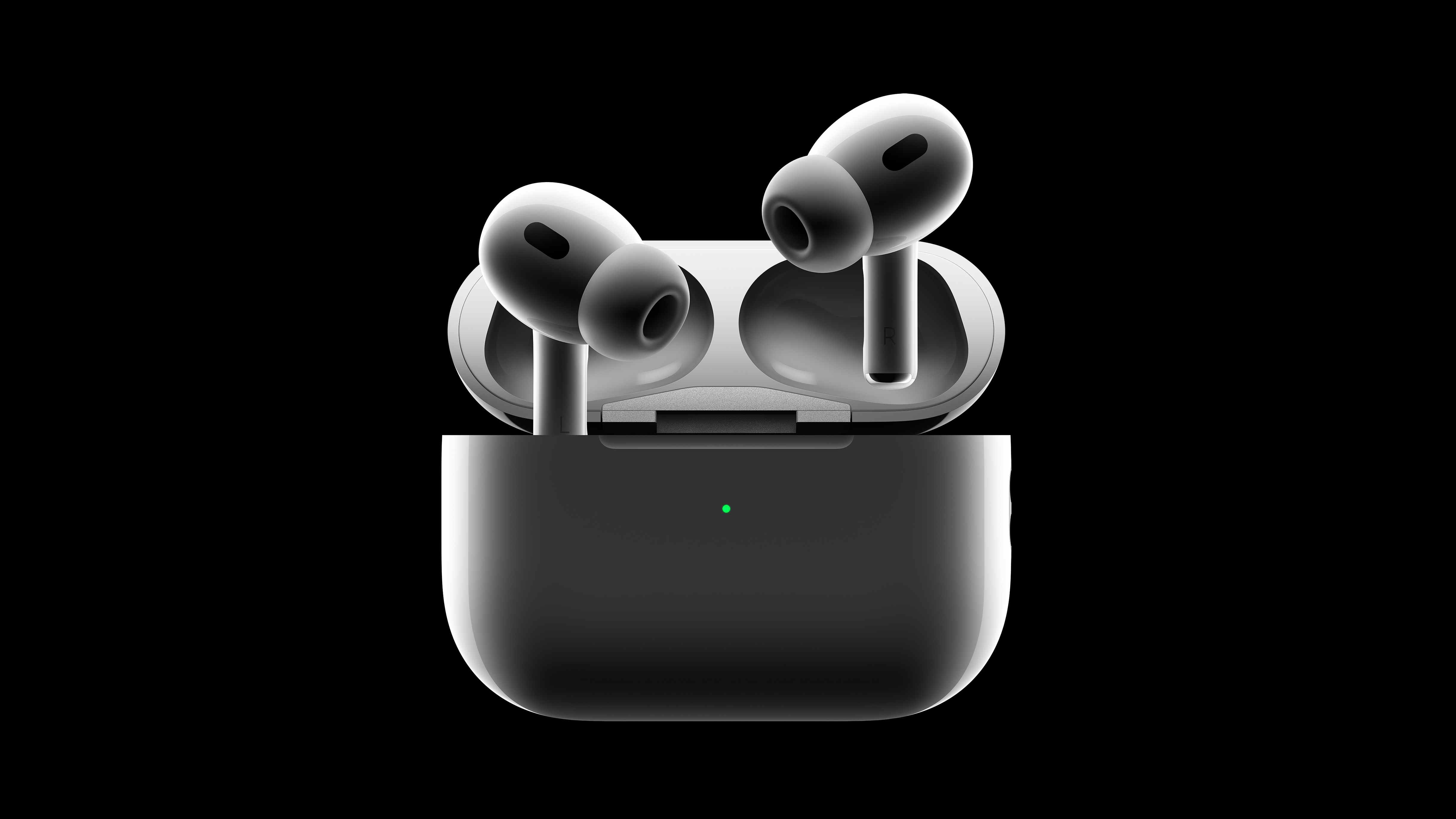 Les bourgeons AirPods Pro 2 sortent de leur boîtier sur fond noir