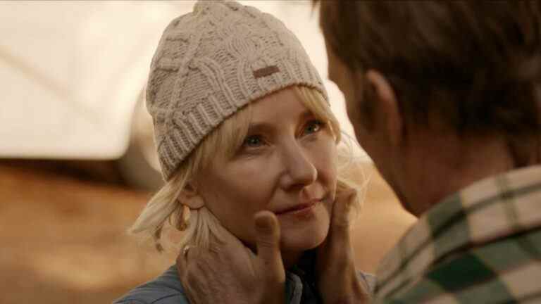 Anne Heche stands with a content look, while Thomas Jane holds her face in his hands in The Vanished.