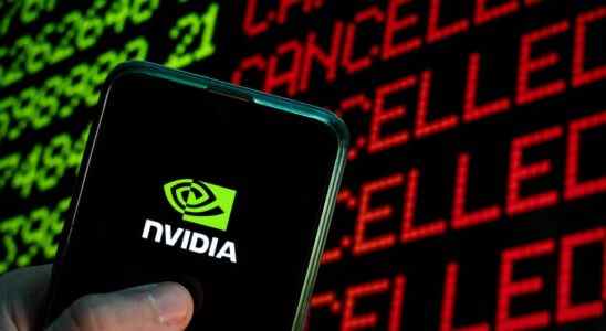 Nvidia logo on phone in front stock ticker.