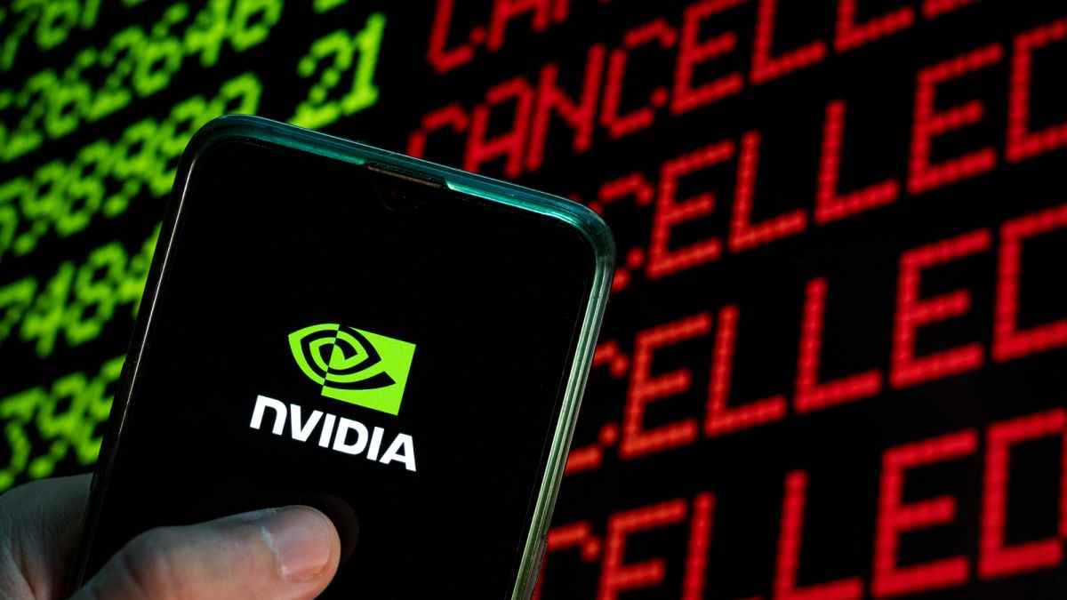 Nvidia logo on phone in front stock ticker.