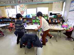 Des élèves dans une classe de New York en mars.