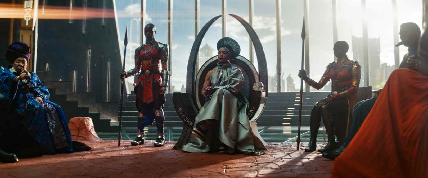 (L-R): Dorothy Steel as Merchant Tribe Elder, Florence Kasumba as Ayo, Angela Bassett as Ramonda, Danai Gurira as Okoye in Marvel Studios' Black Panther: Wakanda Forever