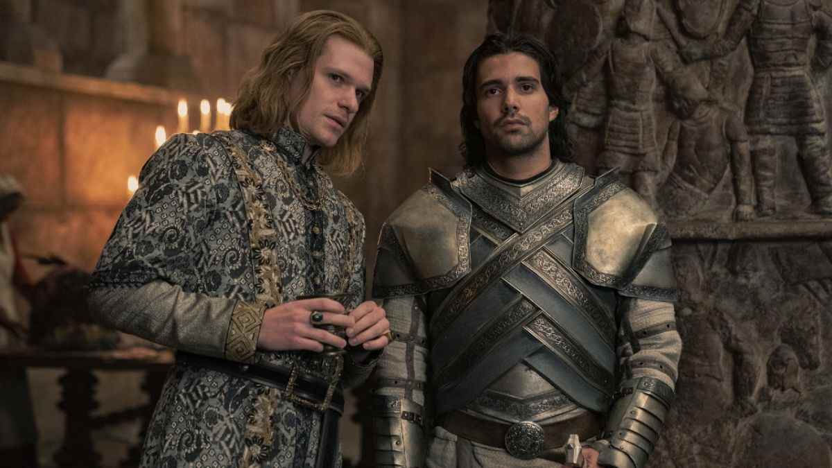 Left Solly McLeod as Ser Joffrey Lonmouth standing next to Fabien Frankel as Ser Criston Cole who is starring blankly forward in Episode 5 of House of the Dragon.