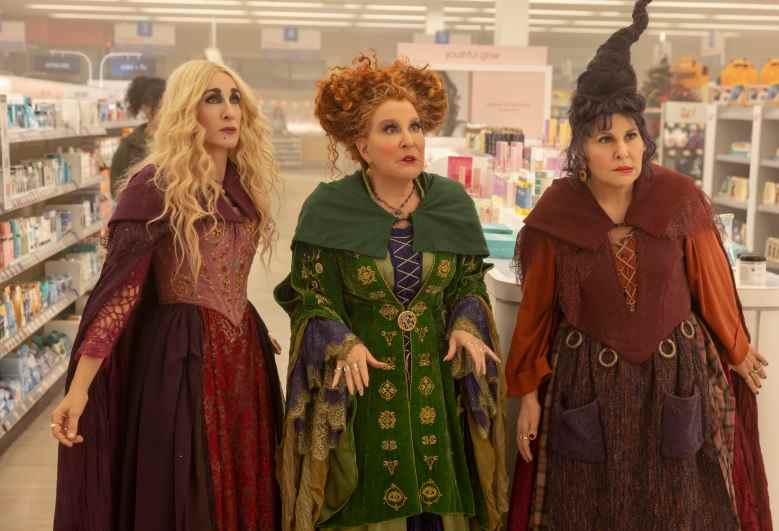 (L-R): Sarah Jessica Parker as Sarah Sanderson, Bette Midler as Winifred Sanderson, and Kathy Najimy as Mary Sanderson in HOCUS POCUS 2, exclusively on Disney+. Photo by Matt Kennedy. © 2022 Disney Enterprises, Inc. All Rights Reserved.