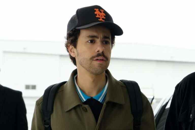 Close up of a man with a mustache wearing a baseball cap; still from "Ramy."