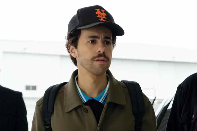 Close up of a man with a mustache wearing a baseball cap; still from "Ramy."