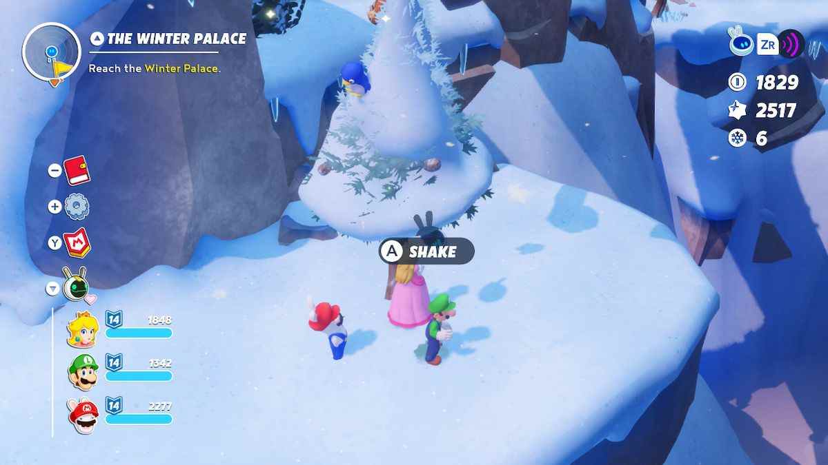 Peach, Rabbid Mario et Luigi se préparent à secouer un bébé pingouin bleu d'un pin dans Mario + Rabbids Sparks of Hope