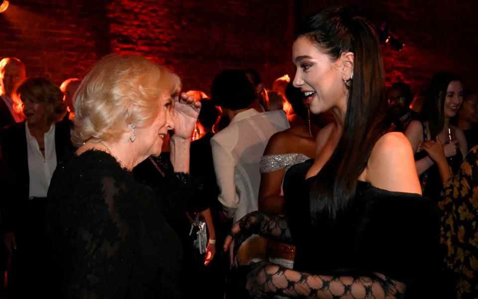 La reine consort et Dua Lipa - Toby Melville/WPA Pool/Getty Images