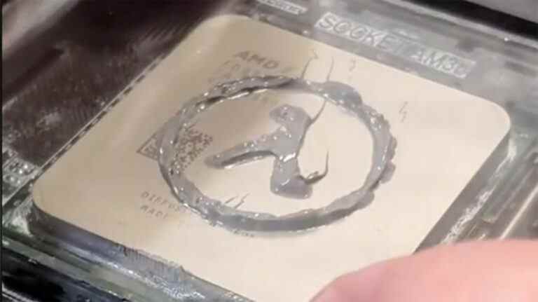 The Half-Life logo drawn in thermal paste on a CPU