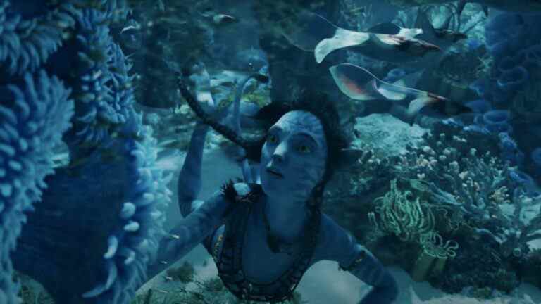 Kiri stares at impressive underwater plant life in Avatar: The Way of Water.