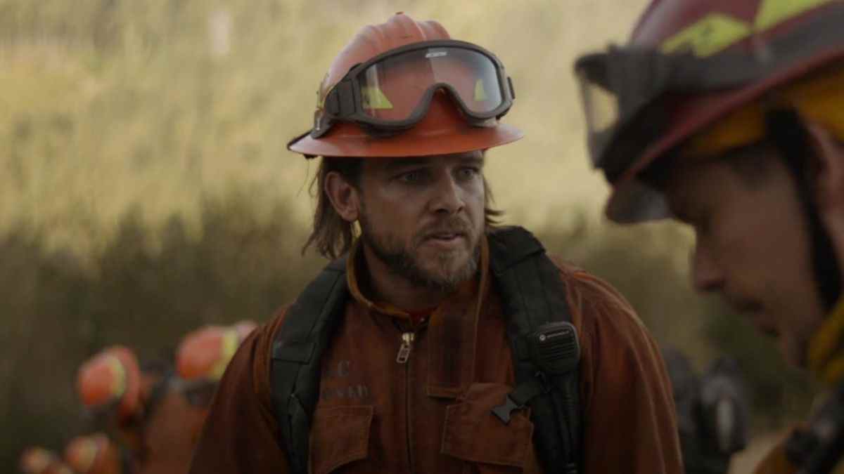 Max Thieriot as Bode talking with his captain on Fire Country.