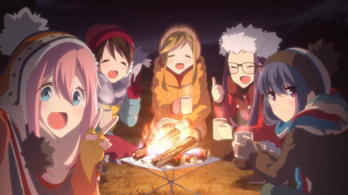 Les filles du Laid-Back Camp chillent au coin du feu