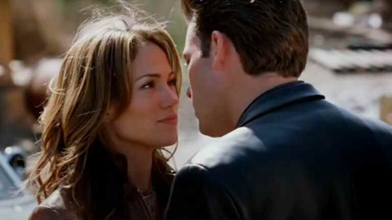 Gigli Jennifer Lopez looks up at Ben Affleck as he moves in closer.jpg