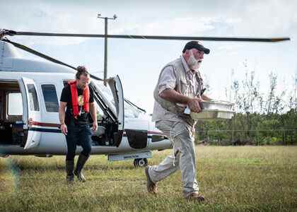 José Andrés (R), carrying a tray of food, and Sam Bloch (L), WCK's Director of Emergency Response. (Credit: National Geographic/Sebastian Lindstrom)