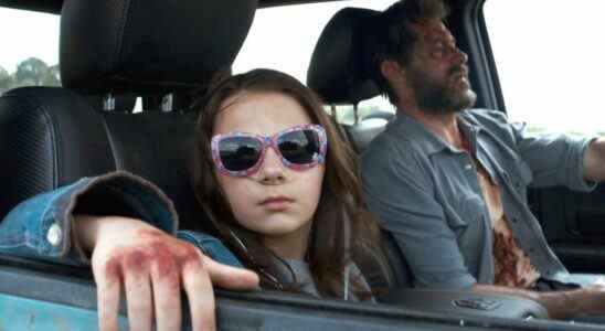 Dafne Keen and Hugh Jackman driving in Logan