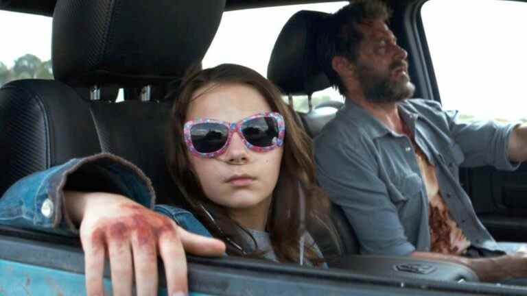 Dafne Keen and Hugh Jackman driving in Logan