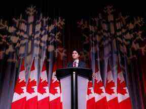 Le premier ministre Justin Trudeau prend la parole lors de la fête des Fêtes du caucus national libéral à Ottawa.