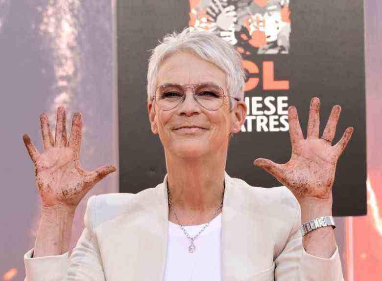 HOLLYWOOD, CALIFORNIA - OCTOBER 12: Jamie Lee Curtis poses after putting her hands in cement during the Jamie Lee Curtis Hand and Footprint In Cement Ceremony at TCL Chinese Theatre on October 12, 2022 in Hollywood, California. (Photo by Kevin Winter/Getty Images)