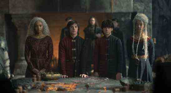 Baela Targaryen (Bethany Antonia), Jace Velaryon (Harry Collett), Lucerys Velaryon (Elliot Grihault), and Rhaena Targaryen (Phoebe Campbell) gather around the lit table at Dragonstone in House of the Dragon