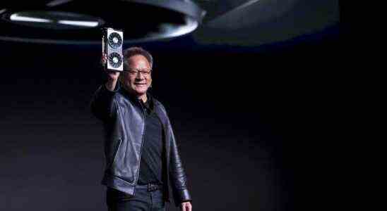 Jen-Hsun Huang, president and chief executive officer of Nvidia Corp., holds up the new Nvidia GeForce RTX 2060 graphics processor during the company