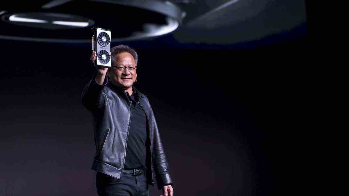 Jen-Hsun Huang, president and chief executive officer of Nvidia Corp., holds up the new Nvidia GeForce RTX 2060 graphics processor during the company