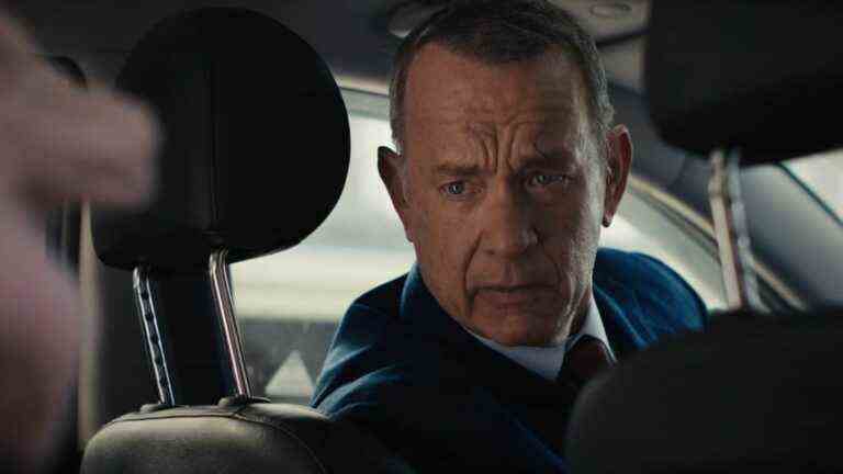 Tom Hanks looks back from the driver