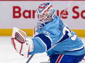 Sam Montembeault des Canadiens effectue un arrêt de gant lors de la deuxième période d'un match de la Ligue nationale de hockey contre le Kraken de Seattle à Montréal le lundi 9 janvier 2023.