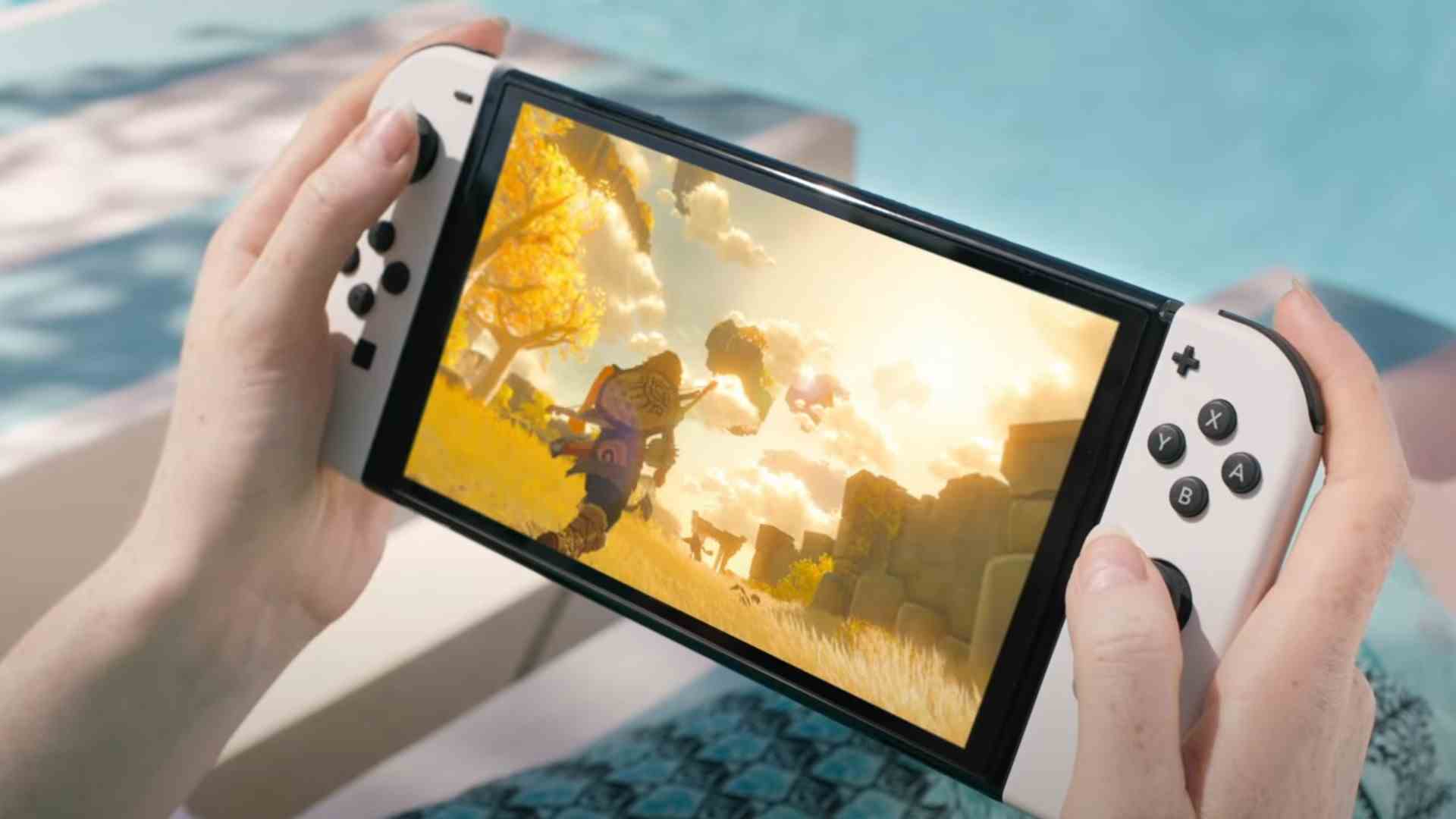 OLED Nintendo Switch blanche en cours de lecture en mode portable