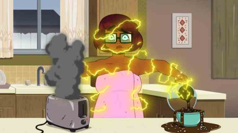 Animated still of a teenage girl in glasses getting electrocuted as she handles a toaster while pouring coffee; still from "Velma"