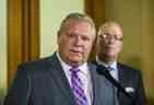 Le premier ministre de l'Ontario, Doug Ford, et le ministre des Affaires municipales et du Logement, Steve Clark, s'adressent aux médias à l'extérieur du bureau du premier ministre à Queen's Park à Toronto, en Ontario.  le lundi 27 mai 2019.