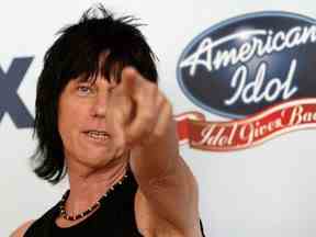 Guitarist Jeff Beck gestures backstage during the 