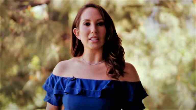 Cheryl Burke in blue dress in Diving Deep with Cheryl Burke